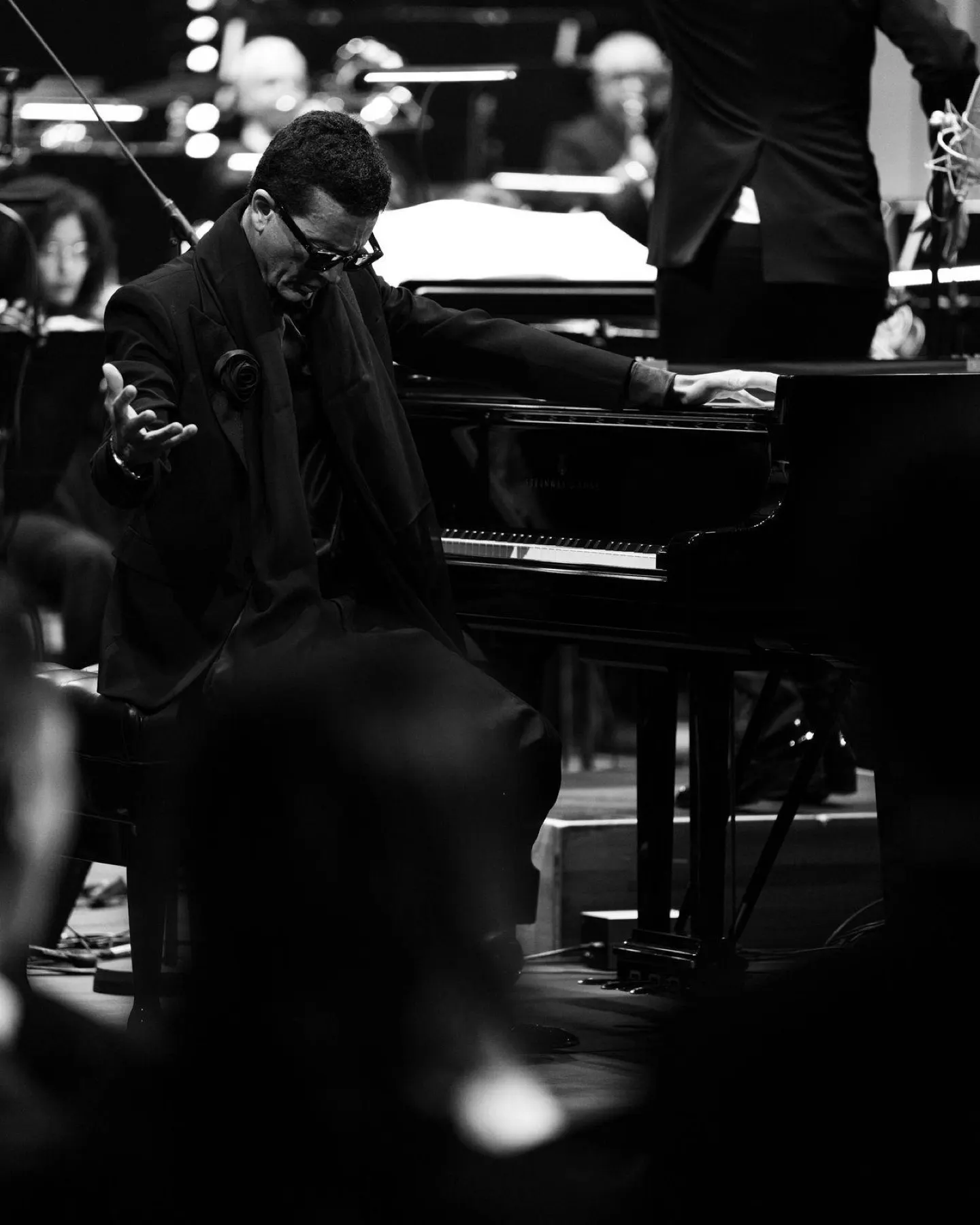 Omar Harfouch seated at the piano during performance