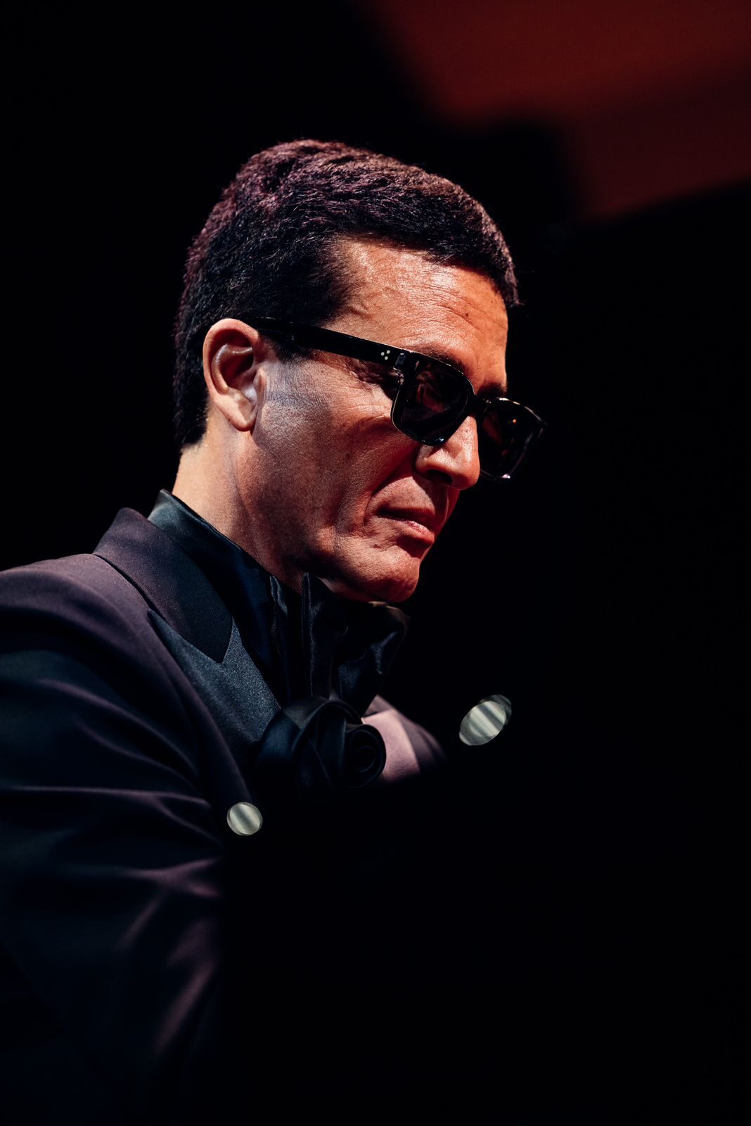 Omar Harfouch in conversation outdoors